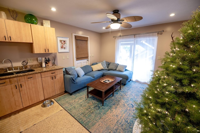 living room featuring sink and ceiling fan