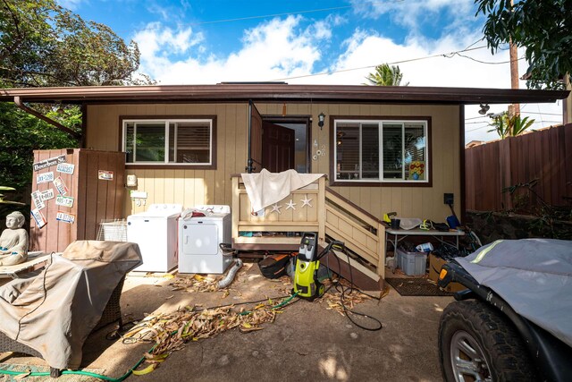 view of front of house with washer / clothes dryer