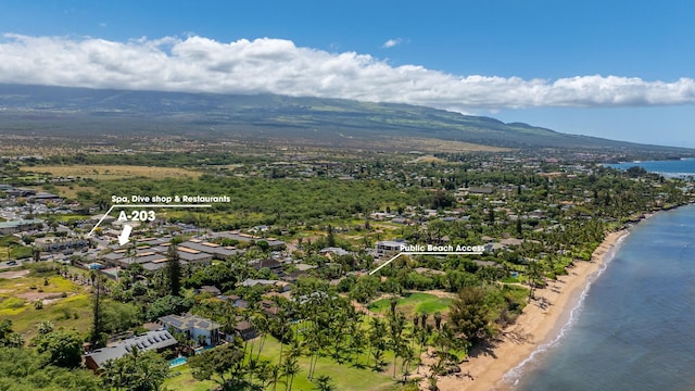aerial view featuring a water and mountain view