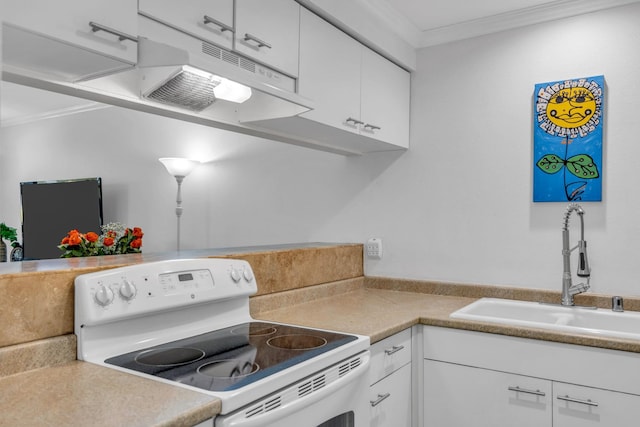 kitchen featuring under cabinet range hood, ornamental molding, white range with electric stovetop, a sink, and white cabinetry