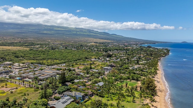 aerial view with a view of the beach, a water view, and a residential view