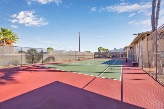 view of sport court featuring community basketball court and fence