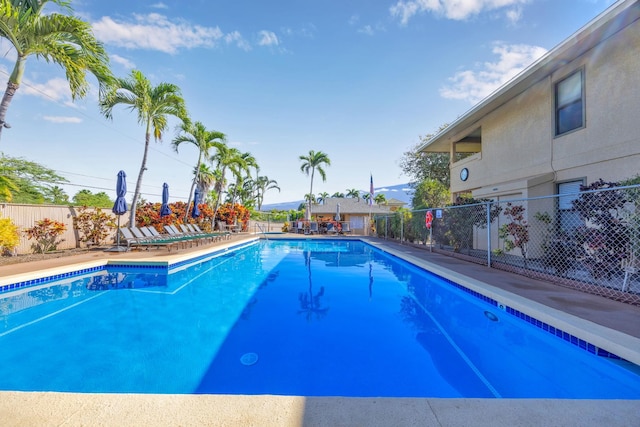 community pool featuring fence