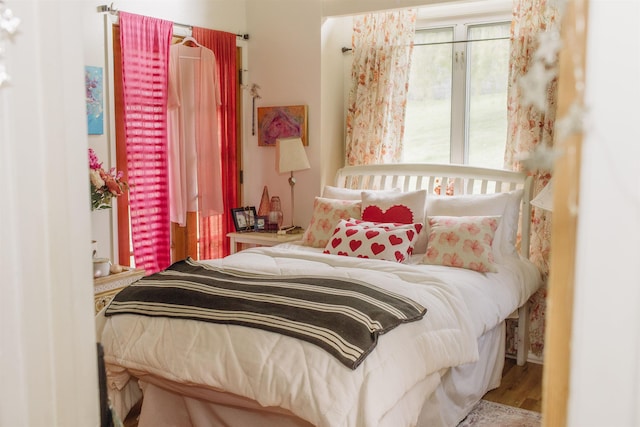 bedroom featuring wood finished floors
