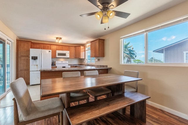 885 Haunani Pl, Wailuku, HI 96793 - kitchen featuring ceiling fan, white appliances, brown cabinetry, wood finished floors, and baseboards