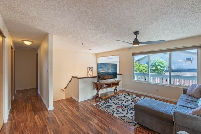 885 Haunani Pl, Wailuku, HI 96793 - living area featuring baseboards, a ceiling fan, wood finished floors, and a textured ceiling
