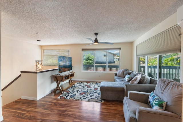 885 Haunani Pl, Wailuku, HI 96793 - living room featuring a textured ceiling, baseboards, a ceiling fan, and wood finished floors