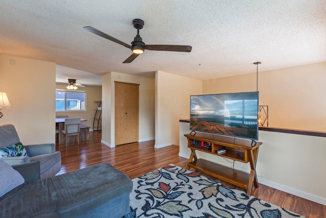 885 Haunani Pl, Wailuku, HI 96793 - living room with ceiling fan, baseboards, wood finished floors, and a textured ceiling