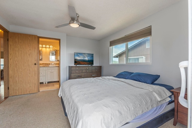 885 Haunani Pl, Wailuku, HI 96793 - bedroom with a textured ceiling, light colored carpet, ensuite bath, and a ceiling fan