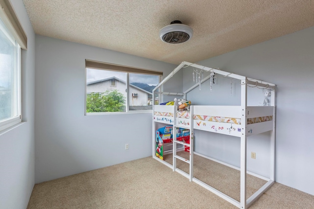 885 Haunani Pl, Wailuku, HI 96793 - unfurnished bedroom with a textured ceiling and carpet floors