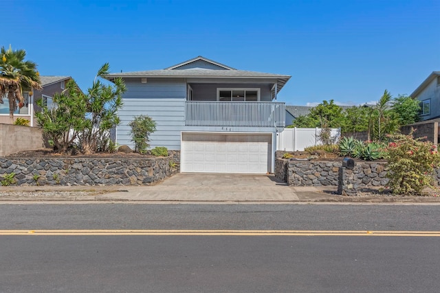 885 Haunani Pl, Wailuku, HI 96793 - view of front of house featuring fence, a balcony, a garage, and concrete driveway