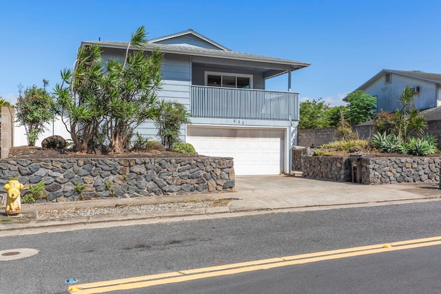 885 Haunani Pl, Wailuku, HI 96793 - view of front facade featuring an attached garage, driveway, and a balcony