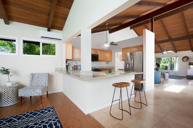 kitchen with wooden ceiling, sink, stainless steel fridge, a wall mounted AC, and kitchen peninsula