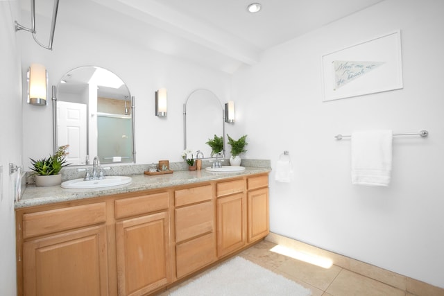 bathroom with beamed ceiling, vanity, tile patterned floors, and walk in shower