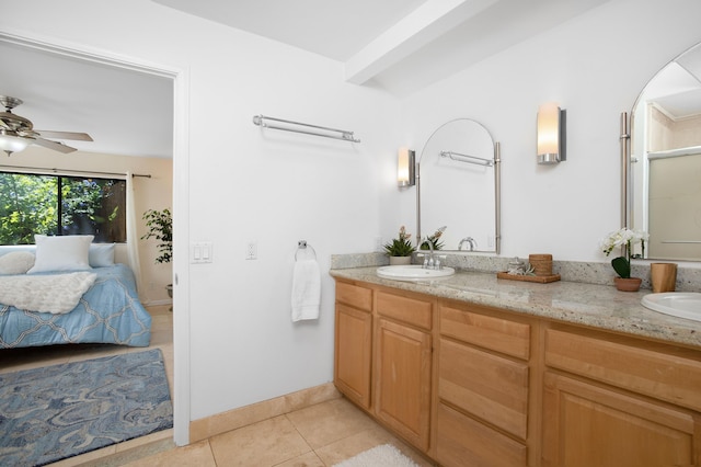 bathroom featuring tile patterned floors, ceiling fan, and vanity