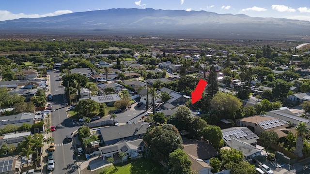 birds eye view of property with a mountain view