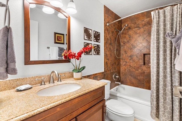 full bathroom featuring shower / tub combo with curtain, toilet, and vanity