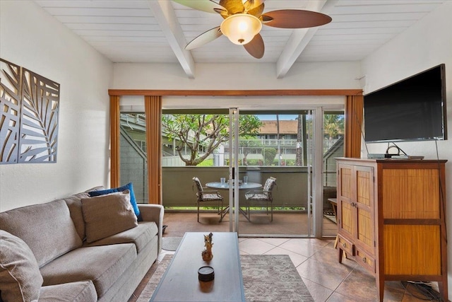 living room with ceiling fan, beam ceiling, and tile floors