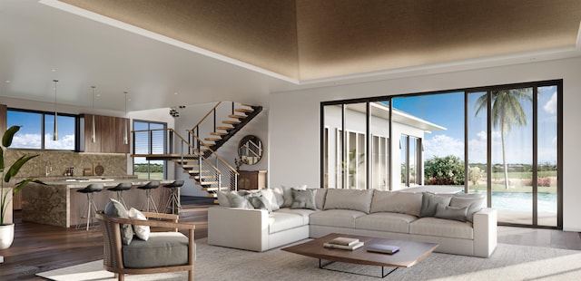 living room featuring a towering ceiling and light hardwood / wood-style floors