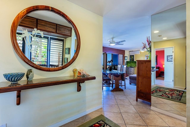 hallway with light tile patterned floors, baseboards, and recessed lighting