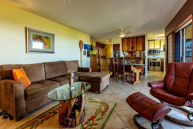 living room featuring ceiling fan and light tile patterned floors