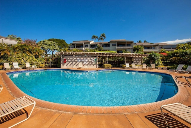 community pool featuring a patio area and a pergola