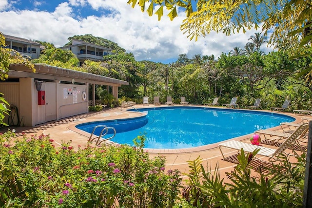 community pool featuring a patio area