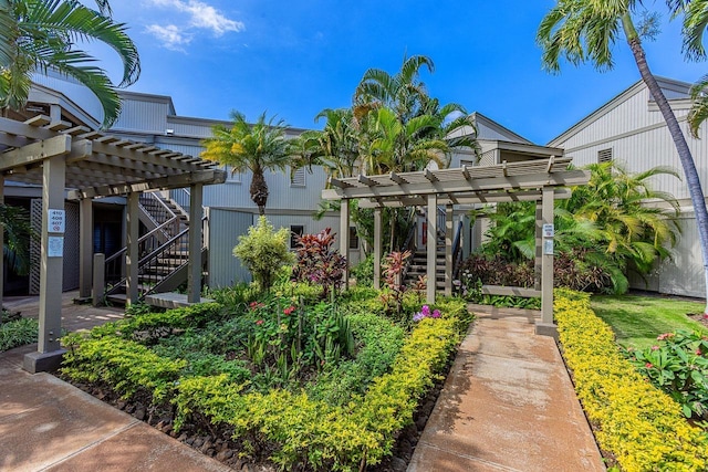 view of yard featuring stairway and a pergola