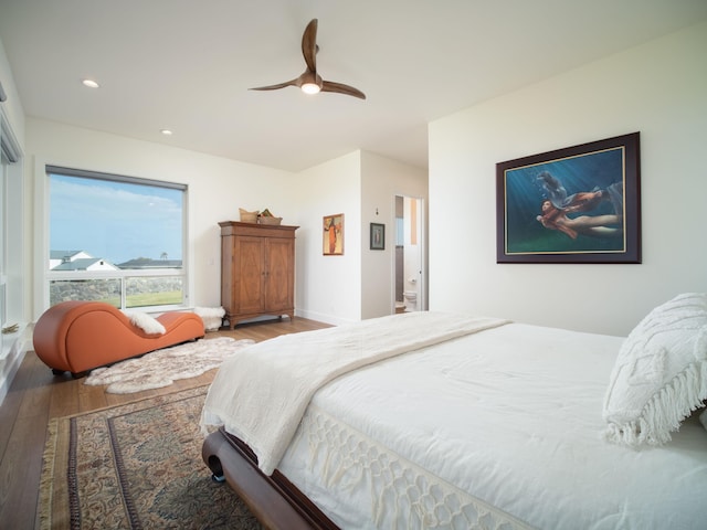 bedroom with hardwood / wood-style flooring and ceiling fan