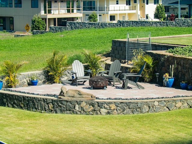 view of yard with a patio and an outdoor fire pit