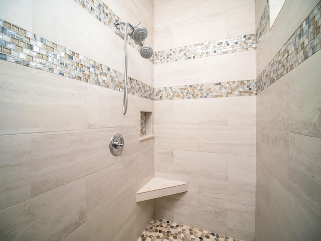 bathroom with a tile shower