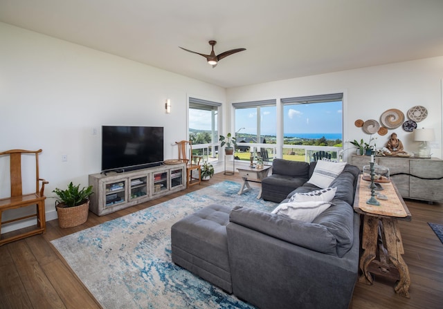 living room featuring hardwood / wood-style flooring and ceiling fan