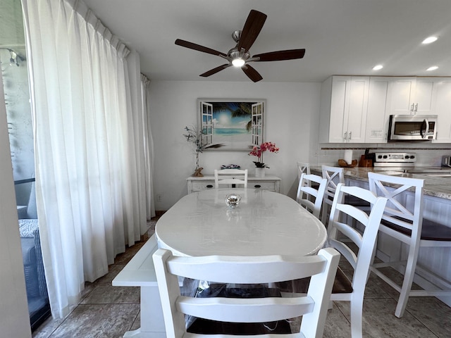 dining area featuring a ceiling fan and recessed lighting