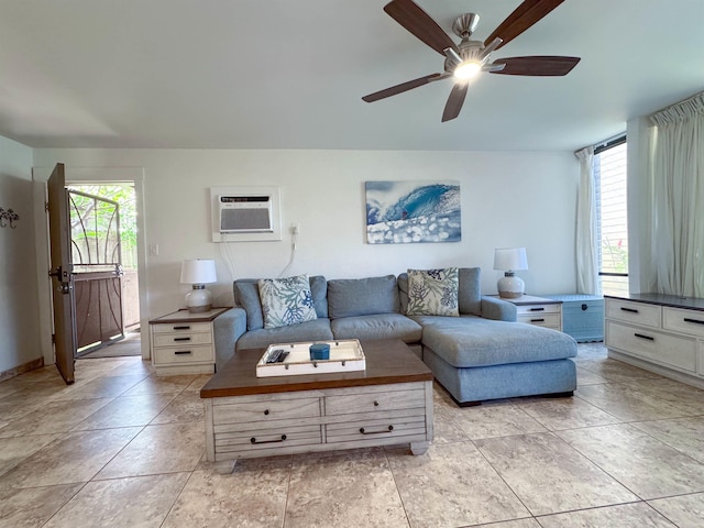 living room featuring an AC wall unit and ceiling fan