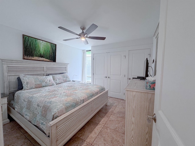 bedroom with light tile patterned floors and ceiling fan