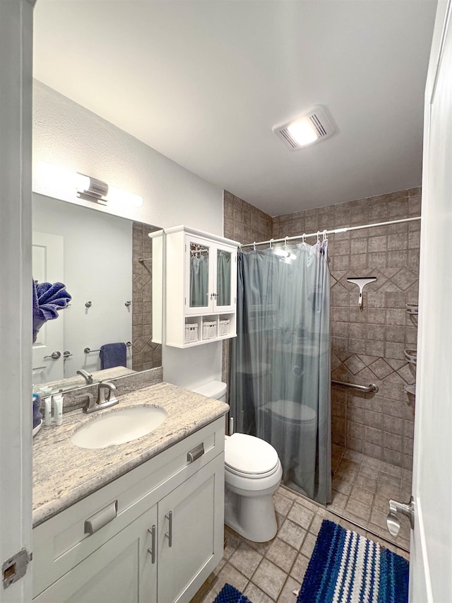 full bath with visible vents, a tile shower, vanity, tile patterned floors, and toilet
