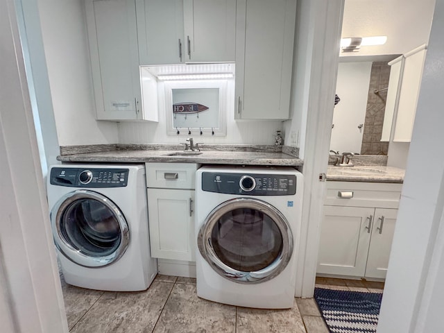 laundry room with washing machine and dryer and a sink