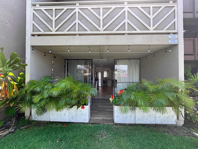 doorway to property with stucco siding