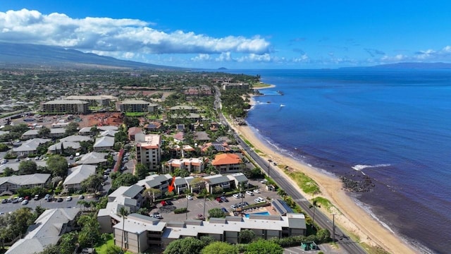 bird's eye view featuring a view of the beach and a water and mountain view