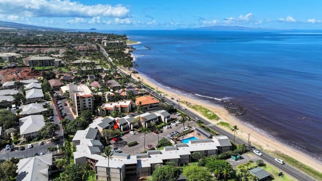 aerial view with a water view and a view of the beach
