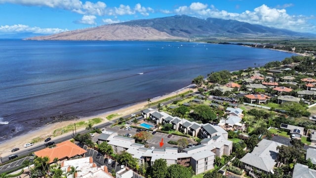 aerial view featuring a water and mountain view