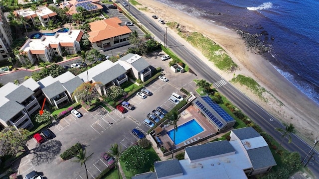 aerial view with a water view and a view of the beach