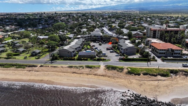 aerial view with a water view and a view of the beach