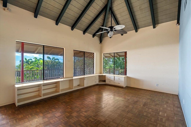 spare room featuring ceiling fan, beamed ceiling, and high vaulted ceiling