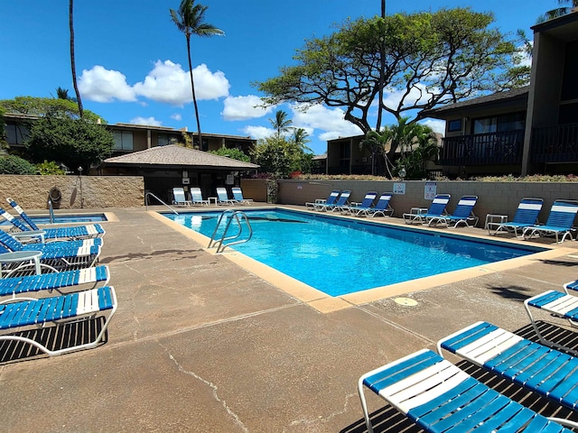 view of swimming pool featuring a patio