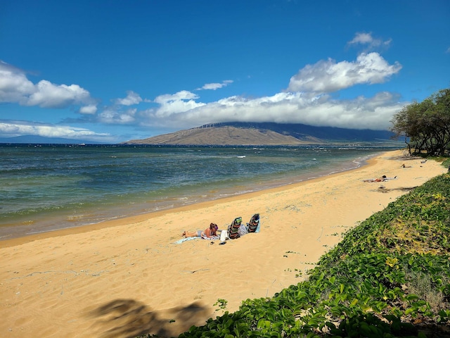 view of water feature with a view of the beach and a mountain view