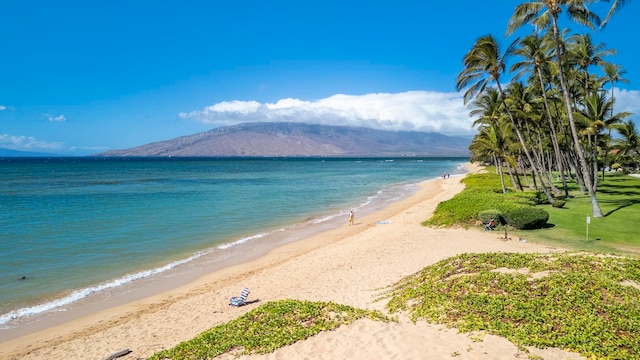 view of water feature featuring a mountain view and a view of the beach