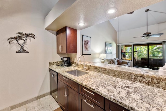 kitchen featuring light stone counters, ceiling fan, dishwasher, sink, and a textured ceiling