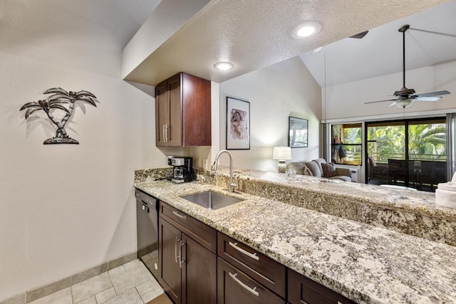 679 S Kihei Rd Unit D205, Kihei, HI 96753 - kitchen with light stone countertops, baseboards, open floor plan, a sink, and dishwasher