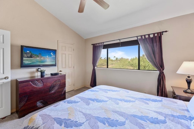 bedroom featuring light colored carpet, vaulted ceiling, and ceiling fan